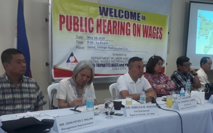 <p><strong>WAGE HEARING.</strong> Western Visayas Labor Regional Director Johnson Cañete (3rd from left) with other members of the Regional Tripartite Wages and Productivity Board-6 during the hearing on the proposed wage increase in Bacolod City on Thursday (May 10, 2018). <em>(Photo by Erwin P. Nicavera)</em></p>